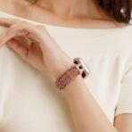 Elegant U-Shaped Diamond Full-Grain Leather Apple Watch Band worn on a woman's wrist