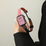 Handheld view of the Two-Tone Magnetic Apple Watch Band, highlighting the secure magnetic closure and leather texture.