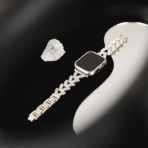 Luxury V-shape diamond metal Apple Watch band on black background