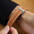 Detailed view of stainless steel buckle on Calf Leather Apple Watch Band