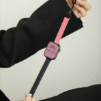 A full-length view of the Two-Tone Magnetic Apple Watch Band, showing the striking contrast between pink and black leather.