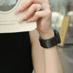 Lifestyle shot of the Black Magnetic Stainless Steel Apple Watch Band for daily office wear