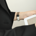 The Two-Tone Magnetic Apple Watch Band in a professional office setting, paired with minimalist workwear.