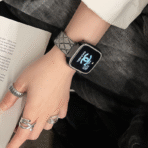 Full display of a silver quilted metal strap on an Apple Watch